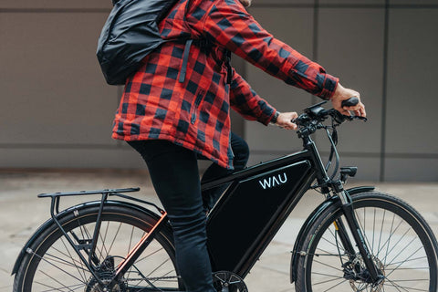 man commuting on e-bike